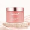 Pot rose fermé de la Medicube Collagen Jelly Cream posé sur une pierre claire dans un décor rose poudré
